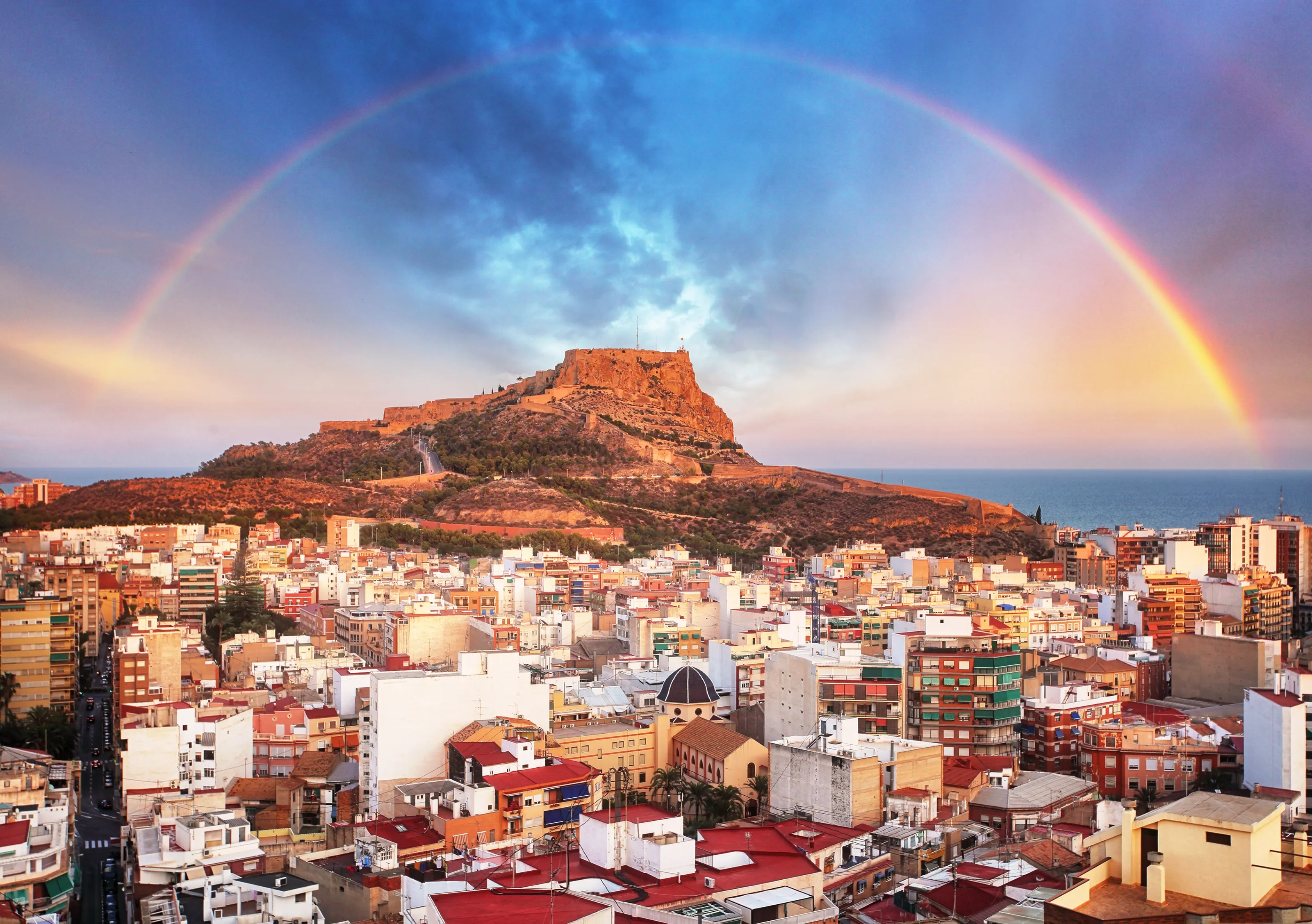 Alicante in Spain at sunset with rainbow